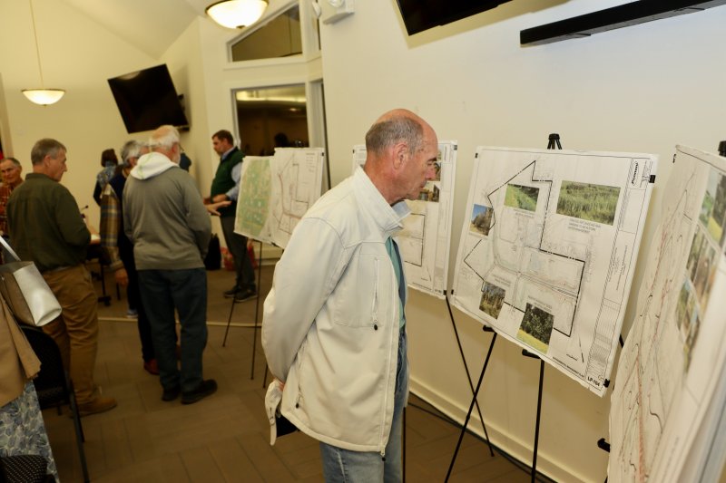 Phil Fields looks at one of the boards that shows part of the conceptual master plan at a public meeting Oct. 27. BILL SHULL PHOTO